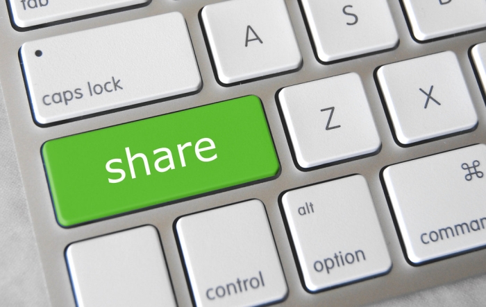 Bilde av tastatur der en grønn tast har teksten "share"